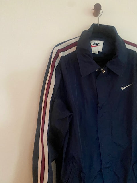 Pre-Owned Nike Navy Nylon Anorak with Stripe Sleeve detail.