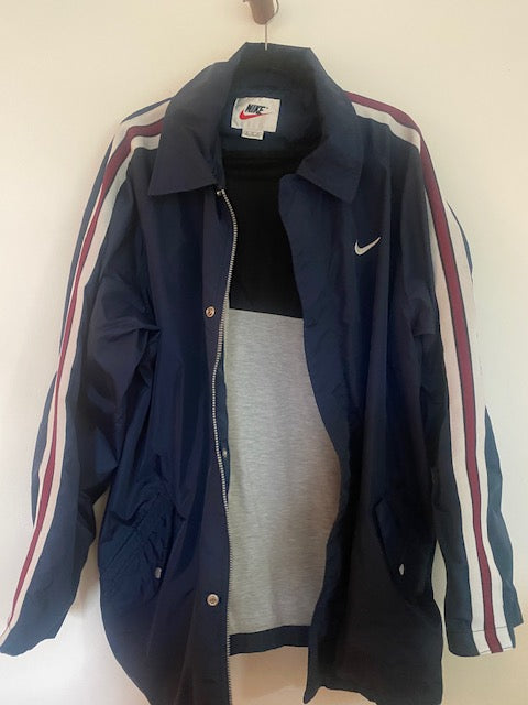 Pre-Owned Nike Navy Nylon Anorak with Stripe Sleeve detail.